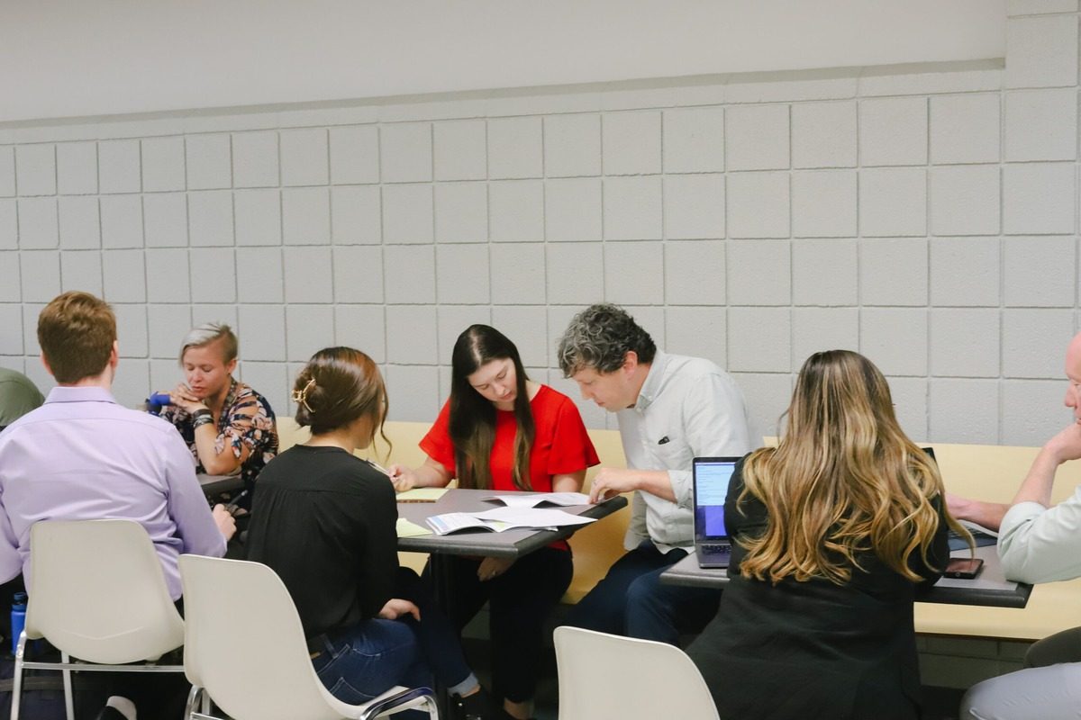 ​​Law students and volunteer attorneys discuss legal issues like debt collection, housing, and employment during Street Law.​ 