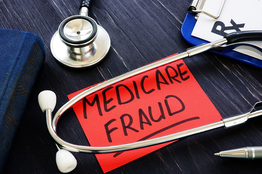 Medicare fraud sign and stethoscope with papers.
